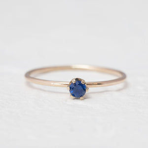 "Aster" dainty birthstone ring in London blue topaz