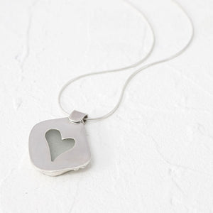 "Rosie" sea glass pendant with heart-shaped cut-out setting